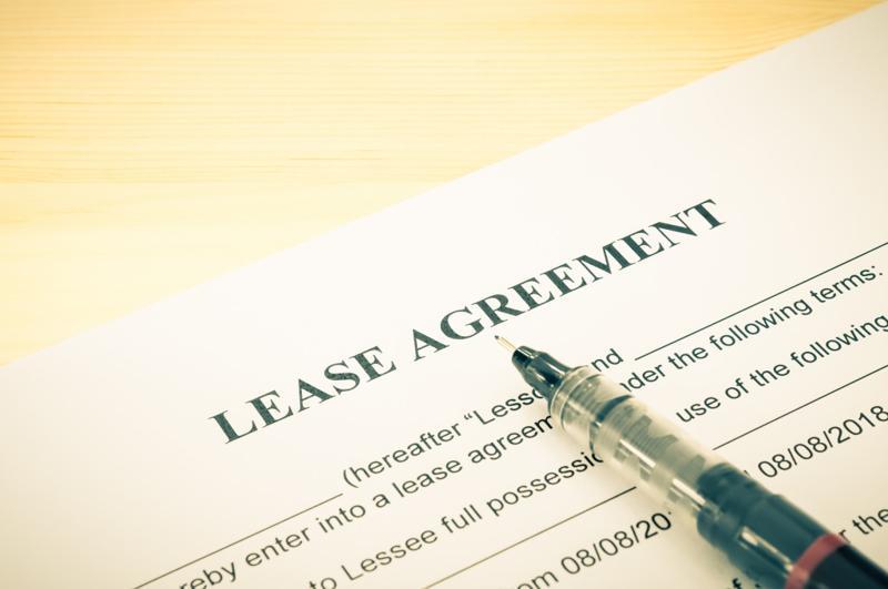 lease agreement contract printed on paper with pen